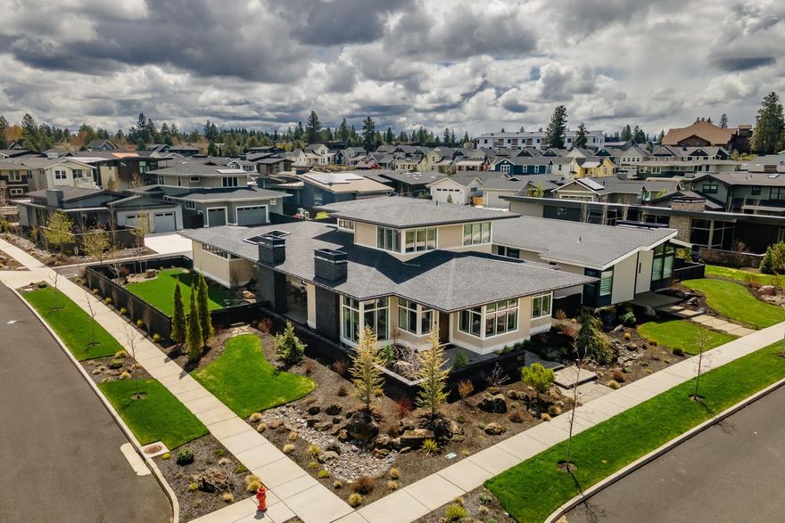 This light-filled home was built on a generous corner lot within the sought after community of NWX. The rich textures in this home offer oak flooring, featured in a herringbone pattern on the first level, and new hardwood flooring on the 2nd level. The Great room provides an abundance of natural lighting from the front courtyard to the backyard living spaces allowing a daily connection to the outdoors. Savor the culinary delights in this freshly updated contemporary kitchen, featuring an attractive centerpiece island, beverage fridge & pantry. The primary suite and bath are located on the main level with a deep soaking tub, a separate tiled shower and a walk-in closet. Entertain fireside, whether indoors or out. Enjoy the large covered patio with infrared heaters, a serene fountain and a fully fenced yard for pets. Through the mud room, you will discover an oversized 3 car garage with cabinetry that is ideal for all your storage needs. This is a must see!