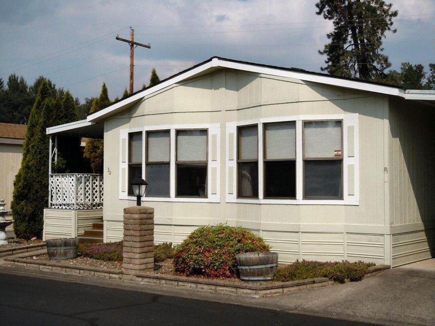 Gorgeous 55+ Leisure Days Mobile Home Park with Rogue River access that includes a park-like area for the residents enjoyment. Storage galore, built-in stereo system, Jacuzzi tub, large walk-in closet in master bedroom. Fenced backyard with garden area and sprinklers to water. Covered front deck/porch, great to enjoy water fountain. Very quiet, peaceful home.