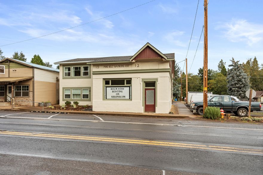 What an Investment Opportunity! Not only do you get a 4-plex, but also a mini RV park with 4 slips—double the income potential in one property. Even has street front business area or storage. Taxes are only $676 per year—less than $60/month! That means profitability goes way up compared to almost anything else on the market. This 4-unit property includes three 1/1s and one 2/1. Two units are rented to long-term tenants, and two are turnkey and ready to go. The upgraded units were previously used as short-term rentals and for owner usage and show great care in updates. One vacant unit even has its own laundry room. Recent improvements include newer carpet, a new roof (2023), new water heaters, and new windows.  Cute little outdoor private sitting area! The 4 RV spaces each have water, sewer, and 30 and 50 amp electricity hookups. Located in the heart of Butte Falls near waterfalls, lakes, a park.. Perfect for investors or owner-occupants looking to live nearly mortgage-free!