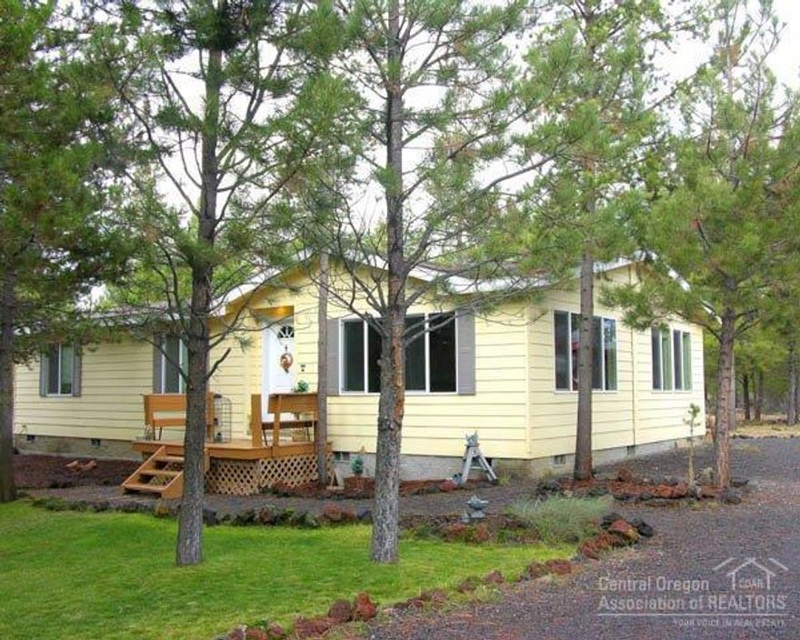 2004 Built Home Backs 100's Acres BLM Land! Only used as a 2nd/Vacation get-away, this 3Bd/2Ba home is in perfect condition! Features: vaulted great room, open dining/kitchen w/large B-Bar, tile backsplash & trim, pantry, vaulted master suite w/walk-in & private bath w/large shower stall, Energy Star insulation+ package, detached insulated garage/shop w/storage wing, frame storage buildings, front deck & covered back deck, nicely landscaped w/circular driveway, cement siding & end of the road privacy!
