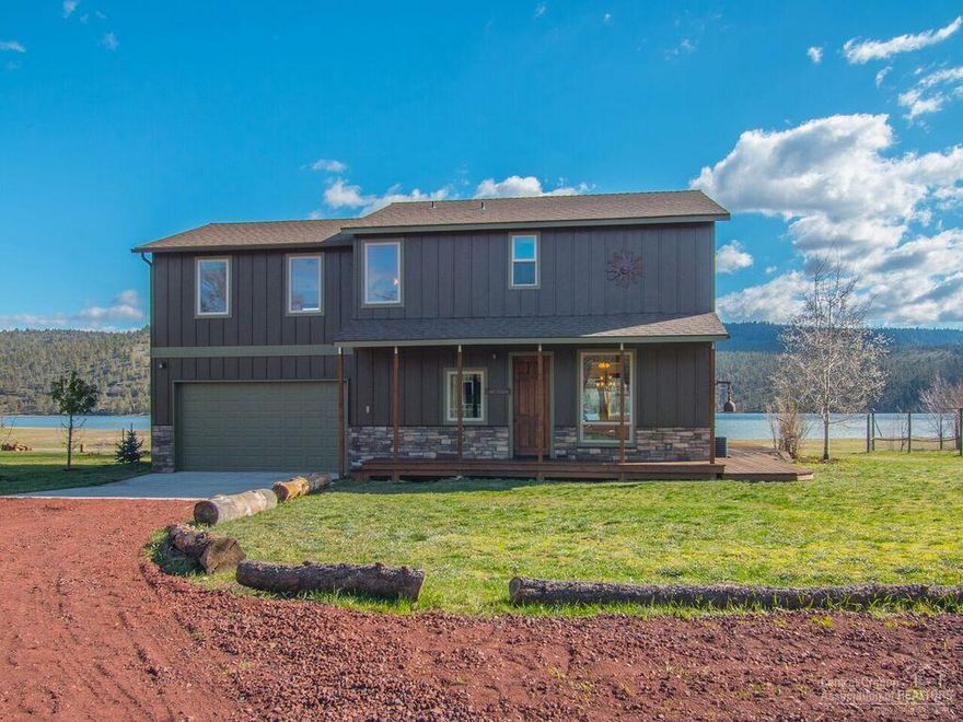 Rare opportunity to own a coveted sunny lakefront home that delivers your own personal haven complete with all the comforts you need.Step outside your back door to your personal lakefront playground for boating,swimming,watching kids swim while you relax on deck,BBQ, or walk out to the dock. Home situated for lake views from every room. Large 2592 sf shop with 12x16 roll up door provides boat & RV storage & there is lots of room to park guest RV's, cars. Adjoining heated & insulated shop has 110&220 power.