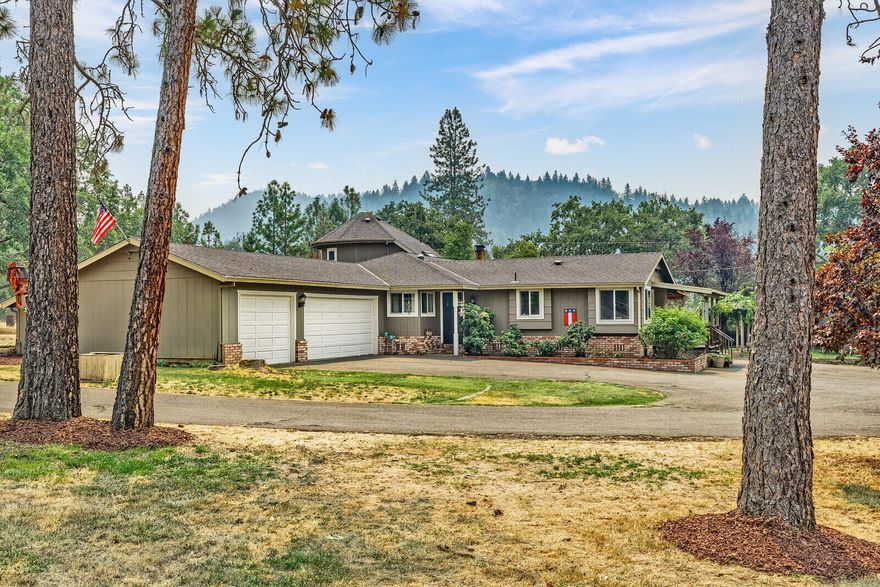 A beautiful home located in the desired Colonial Valley allows for many possibilities for country living and is just minutes from downtown Grants Pass. Currently features a large Primary Suite, with the option to convert the 4th bedroom into a Secondary Primary Suite. The Primary Bathroom features a large jetted tub, oversized double vanity, an abundance of storage, and a private entrance to the mature landscaped backyard. The office is directly off the deck for a peaceful work-from-home environment. In the spacious backyard, summer nights can be spent picking fruit (pear tree and plum tree) or delicious grapes from the well-established grape arbor. The property features a workshop with a loft plus covered parking on either side for your tractor and implements. Additional covered RV/boat storage area ensures your recreational toys are out of the weather, PLUS an oversized 3 car garage. Space for possible ADU. Please see attached documents for list of updates.