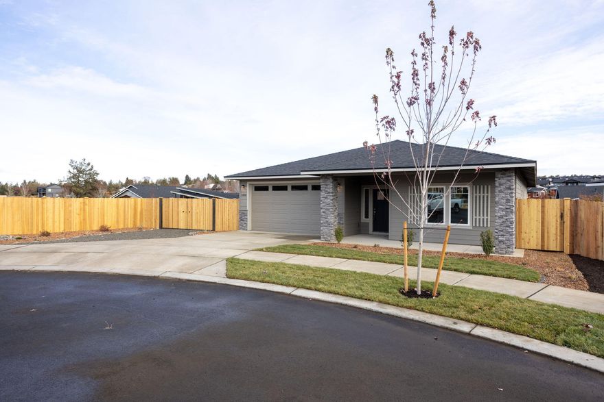 Just completed! Welcome to Korbin Meadows, Phase 1, a new community in desirable neighborhood of SW Redmond. Lot 1 features the Tundra floorplan w/ contemporary NW design on a 9,800 sf corner lot. Enjoy amazing Cascade Mountain views from the covered front porch. Single level living with 3 bdrms, 2 baths and 2 car garage. Extensive separation between primary bdrm (w/ walk-in closet & double vanity) & 2 guest bedrooms w/full bath. Entertain in your kitchen w/ SS appliances, pantry, full height tiled backsplash, extensive slab quartz countertops, large island opening to great room w/ decorative gas burning fireplace. Durable laminate plank flooring thru-out & carpeted bdrms. Utility/laundry room too. Fenced yard & landscaping w/ sprinklers, RV/boat parking, entrance gate, aspen rock upgrade & prepped for a shed in backyard. *Floorplan rendering subject to change.