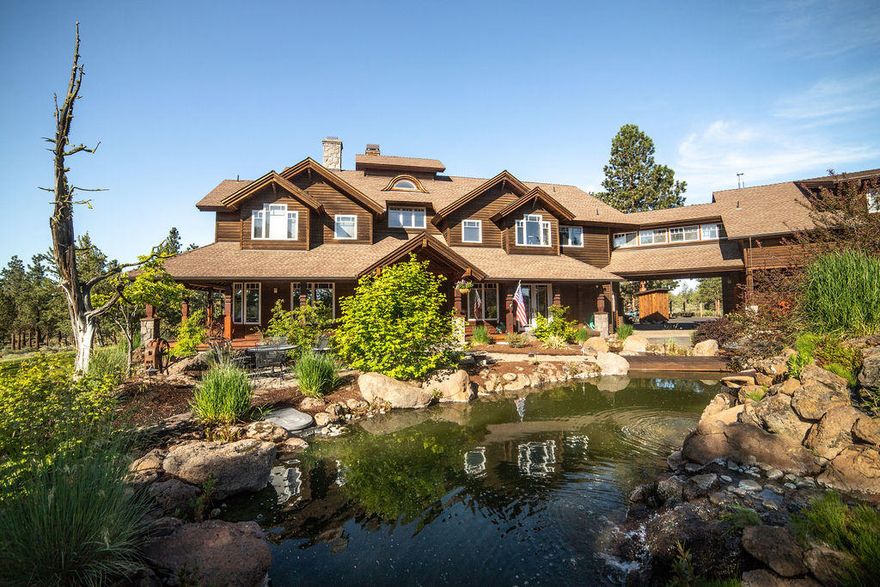 Custom built home/loge set amongst 160 acres, bordering public land, and just 4 miles from downtown Sisters, offers stunning mountain views! Custom oak floors throughout, elegant woodwork, new kitchen island, refinished flooring, 2 new heat pumps, stone fireplace, home movie theater, new TV's, concrete dance floor w/ lights/speakers. Legal ADU w/ private entrance, kitchen, bdrm. Additional guest suite in garden w/ sauna and bathroom. Indoor sunroom/patio offers relaxation or a great entertainment space.This award winning and masterfully crafted home has everything you could ask for in and on a property. Multi-bay shop, barn, hay storage, 3 car garage, dirt bike track, chicken coop, set up for cattle and/or horses. Sit outside and watch the sunrise/set by the lovely river-like water features and pond. Newer hot tub included. View the video for a taste of this exquisite home. Matterport link and attached amenities sheet for your viewing pleasure!