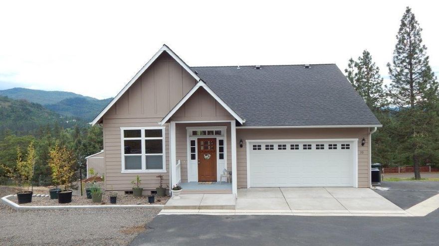 What a knock out, hole in one home this is! Open Craftsman built in 2007 with 2,100 glorious sq. ft. of fine living. Built in the hills of Shady Cove with views clear to the Siskiyou's yet just a stone throw to the infamous Rogue River for your fishing and rafting pleasure. This home is finished with granite counters, bamboo flooring, walls of windows, crown molding, vaulted ceiling, and covered deck for year around enjoyment. While this has a walk-out daylight basement, everything is on the main floor, the basement gives additional room for company and games. But wait, there's more! Basement leads to your covered patio then to your own nine hole putt putt course! Could it get any better? Yes! The bottom of the .52 acres has a paved RV Pad! Easy Care Yard with raised garden beds, garden shed and drip lines to the potted and planted greenery.