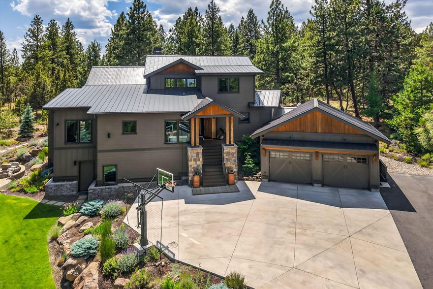 MOTIVATED SELLER and INCREDIBLE VALUE at $376/SF! PRICED to SELL! Timeless Northwest Contemporary design & quality craftsmanship located at the end of a quiet cul-de-sac on Bend's Westside. Immaculately maintained 5 BR home offers over 4600 SF of living space & stunning finishes throughout. Great Rm features vaulted ceilings, a wall of windows overlooking the treetops, and floor-to-ceiling fireplace creating the ideal space for entertaining. Chef's Kitchen w/expansive island, sleek Quartz countertops & subway backsplash, commercial grade JennAir appl & walk-in pantry. Spacious Dining area w/access to back deck, yard & patio w/built-in gas fire pit. Main Level Primary Suite offers a spa-like BA w/dual vanity, soaking tub, steam shower, walk-in closet PLUS private home office. Main level Jr. Suite w/dual vanity & tiled shower. Upstairs: 2 BR/full BA + loft flex space. Lower Level: Bonus Rm/5th BR w/full bar + 4th full BA. Heated driveway & oversized 3 car garage for all your Bend gear.