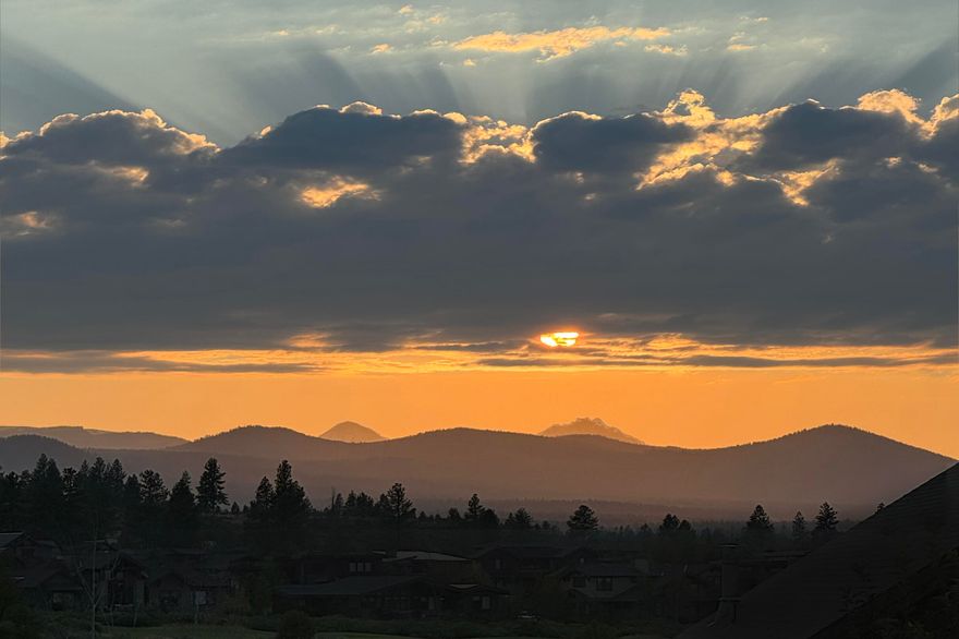 This 2,362 sq ft, single-level townhome in Tetherow is your ultimate basecamp for Central Oregon. Enjoy stunning Cascade Mountain views and a design where sophistication meets comfort.

The chef's kitchen features two islands, an induction cooktop, and seamless flow into the dining area and family room. Step onto the patio, perfect for quiet evenings or entertaining. A versatile den with a closet serves as a third bedroom, office, or creative space where you can enjoy the ease of electric blinds.

The primary suite boasts a luxurious bath with double vanities, heated floors, a walk-in double shower, and a custom oversized closet.

Minutes from downtown Bend, Mt. Bachelor, and the Cascade Lakes, this home offers unparalleled access to outdoor adventures. Situated in the award-winning Tetherow community, enjoy lush greenspaces, resort amenities, and the renowned David McLay Kidd golf course. Discover the finest in Tetherow living today!