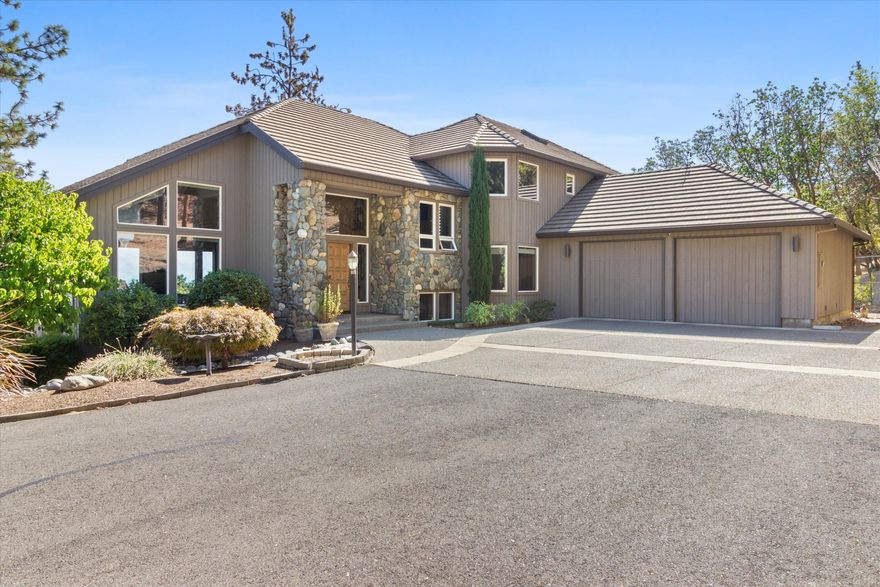 First time on the market! Nestled on 10.16 very private acres that back up to BLM land, this meticulously cared for home is a rare find. Boasting 4 beds, 3 full baths & 4521 sq ft . You'll be awestruck by the panoramic views from every corner provided by an abundance of windows that flood the home w/ natural light. You'll love the spacious kitchen, featuring double ovens, big island w/ cooktop, prep sink & a large window framing the breathtaking views. Enjoy outdoor entertaining on the deck, perfect for hosting gatherings w/ family & friends. Inside you'll find vaulted ceilings w/ log beams sourced from the property, a wood-burning fireplace w/ river rock surround, beautiful hardwood floors, tile entry & formal + informal dining. Master has a private balcony & tray ceilings while 2 addl bedrooms come complete w/ built-in desks & a Jack & Jill bath. Oversized 2 car garage + addl one car garage w/ a workshop & bonus rm. Don't miss this exceptional home!