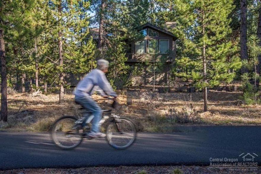 Updated home on a large Sunriver lot backing to the bike path. Perfect vacation home or full time residence. This split level home has 1 bedroom up and 2 down, granite countertops, hardwood flooring, sunroom, pellet stove, private deck area and a 2 car garage. Situated at the end of a cul-de-sac for privacy yet close to the Village, SHARC and everything that Sunriver community has to offer.