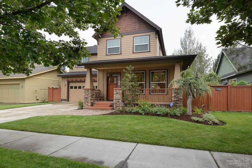 Spacious main level living, with massive windows to let the natural light in. Notice new hardwood flooring as you stroll from the living room, kitchen and dining area. The guest half bath offers a bit of whimsy, not to be missed. Kitchen recently installed solid granite counter tops. Upstairs master suite is separated from 2 large bedrooms, full bath and laundry. New counters and backsplash in both upstairs bathrooms. Outdoors is a private retreat, complete with a water feature & inviting covered deck area.