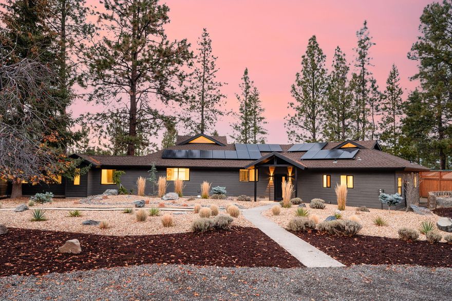Immerse yourself in nature's beauty at this stunning 2,864 SF RIVERFRONT home. Perched on a 1-acre lot above the Deschutes River across from national forest land, this completely remodeled 4 bed, 3 bath home offers breathtaking river views from the primary bedroom, living room + dedicated office. Every surface in the home is new, including the gourmet kitchen with new high-end appliances, calacatta gold solid surface counters, and spacious pantry with beverage cooler. Luxuriate in a spa-like bathrooms, complete with steam shower, heated towel rack, soothing aromatherapy + bluetooth speaker. Unwind in the cozy movie room, explore the versatile loft spaces, rock climb or store gear in the unique 'rock room'. Xeriscaped yard, 3 decks,RV parking + private walking path along the river offer serene outdoor living. Home has solar, a new high-efficiency heat pump + some new windows. Just 10 mins from Old Mill and downtown Bend, this home has the perfect blend of tranquility and convenience.