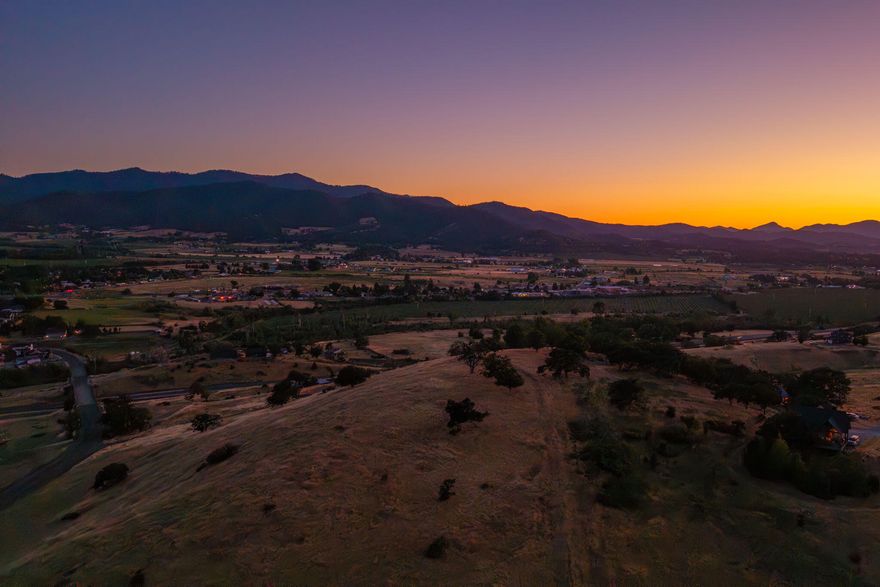 A Beautiful Southern Oregon View Property
Located in Talent with panoramic views of the valley, this 10.31-acre property has so many great features. Nestled in the east hills of Talent, the property is surrounded by orchards and wineries with great southern exposure. It is EFU zoned, with two wells, the septic has been installed, and there is TID irrigation for two full acres. Electricity is at the road, and there is so much potential for a fabulous custom home. A new access road has been installed and the gate is at the bottom of the road on Suncrest. A one-of-a-kind hilltop property with seclusion and privacy.