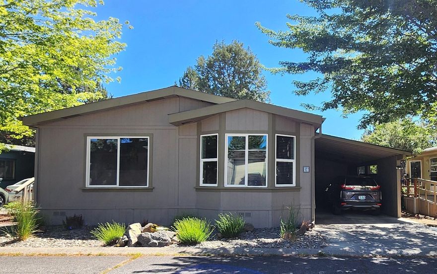 Well-kept, move-in-ready home in desirable 55+ Suntree Village! New roof, vents, and some added gutters in Jan 2024.  Great room plus separate family room have vaulted ceilings.  Abundant kitchen cabinets and countertops. Good-sized laundry room with countertops, sink, storage, and door directly to attached carport. Updated laminate flooring in public areas.  Primary bedroom has large walk-in closet. Primary bathroom has dual vanity, soaking tub, and separate shower. All appliances included.  Low maintenance front yard. Plenty of room for gardening in the backyard. Home sold AS-IS. Space rent is $585 and includes water, sewer, garbage, clubhouse, street snow removal, and sprinkler blowout in the fall.  Come check out this terrific home!