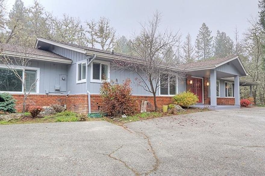 Single-Level 2,240 Sq Ft Home on 1.84 Acres just moments from Town! This Home offers a Huge Living Room with Fireplace, Large Family Room, and a Spacious Kitchen with plenty of Cabinetry. You absolutely cannot beat the location of this Rural Home and Property. Set at the very end of Espey Road and directly adjoining BLM/Cathedral Hills, you will enjoy the ability to hike and recreate right from your own property! Parking includes a Paved Driveway, 4-Car Carport, and RV Port. 792 Sq Ft Barn/Stable with 2 Stalls and Tack Room is perfect for keeping your Horses and riding directly from your own property through the Cathedral Hills System of Established Trails. Home is Private from Neighbors, and move-in ready. Easy walking or a simple one-minute Golf-Cart drive to Grants Pass Golf Course. NO Marijuana grows in this Neighborhood! Enjoy Peaceful Rural Living in a fantastic location mere minutes from Downtown.