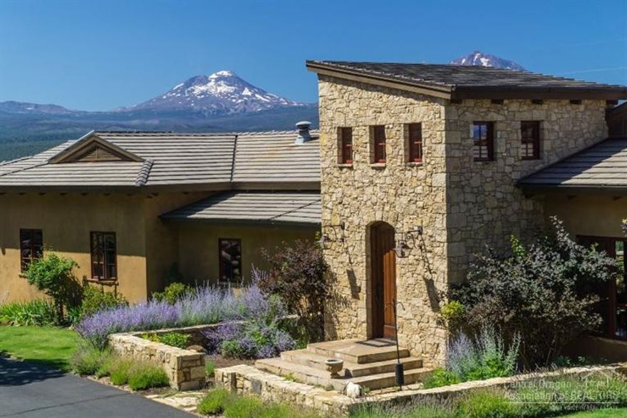 This extraordinary home sits above the charming town of Sisters, Oregon - with spectacular views of the Cascade Mountains, from Broken Top to Mt. Jefferson. The extensive landscaping of the 10.79 acres enhances the private, serene setting. Custom designed by renowned architect Janet Jarvis, the home has unique Tuscan influences, with quality materials and workmanship throughout. Ideal floor plan, Master Suite on main level, large kitchen with limestone countertops, theater room, sauna, exercise room and mor