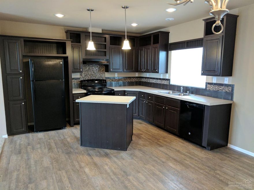 New Palm Harbor home with double carport and large storage, rear lawn area, corner lot. Pristine view of snow capped Cascade Mountains!! 55+ park for one resident 45 for spouse. Monthly space rent $ 400.00 includes water, sewer garbage! Financing readily available! Truly Affordable Housing!! Located just outside Redmond with full services, hospital, airport full shopping, parks, active senior center, Super Walmart, Fred Meyer. . . *** ALSO *** There still a few spots left for another new home!!! Call