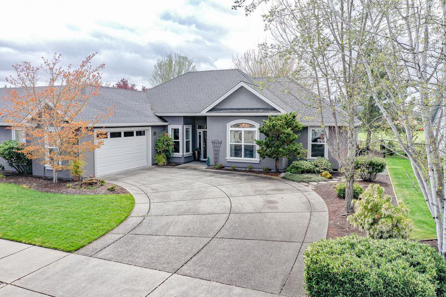 Golf course living at its best! This impressive single level home on the third fairway of the Eagle Point Golf Course offers formal dining and living rooms and a family room with gas fireplace and floor to ceiling windows to enjoy the stunning views. With gorgeous granite countertops, island, stainless appliances, breakfast bar, and eating nook, the classic kitchen invites gathering to prepare meals while visiting with guests. The master bedroom includes a luxurious sitting area and a generous master bath which features a double vanity, soaking tub, shower, and walk-in closet. This spacious home boasts plenty of inside storage as well as additional storage in the oversized garage. Extending the indoor living area to the outdoors, the back patio provides space to relax and enjoy fantastic views of the golf course and surrounding mountains.