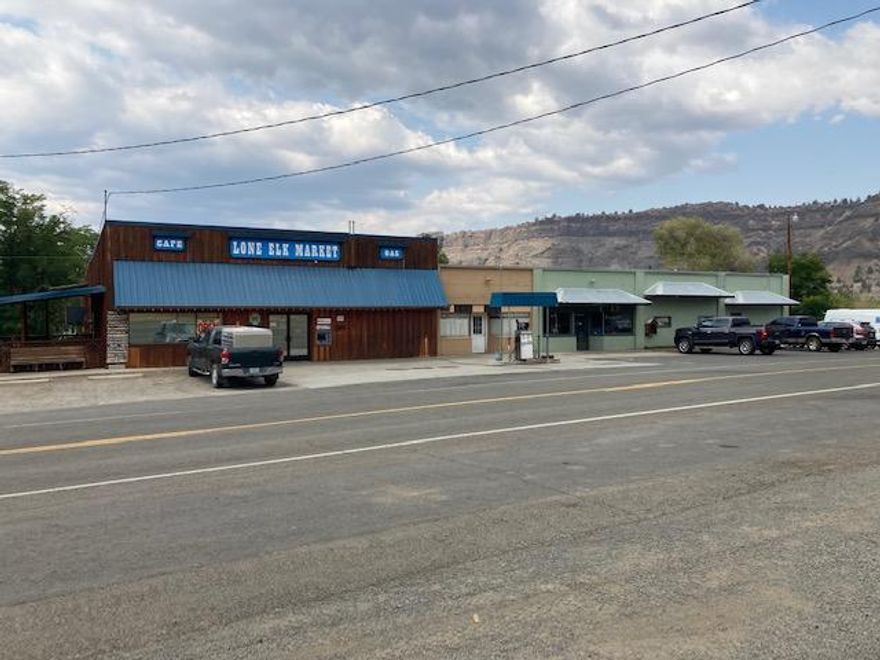 LONE ELK MARKET!  Thriving & Tidy Turn Key Business In Spray Oregon!  The Lone Elk Market has a prime location off of hwy 19 near the John Day River, serving locals & visitors alike in a country comfortable atmosphere, great opportunity to be your own boss, with 3000+ sq ft offering groceries, meals, ice, propane & fuel, with an additional 2850 sq ft of storage or additional business income, plenty of parking, covered outdoor dining, large walk in cooler, large walk in freezer, ice machine, ATM.  $583,000