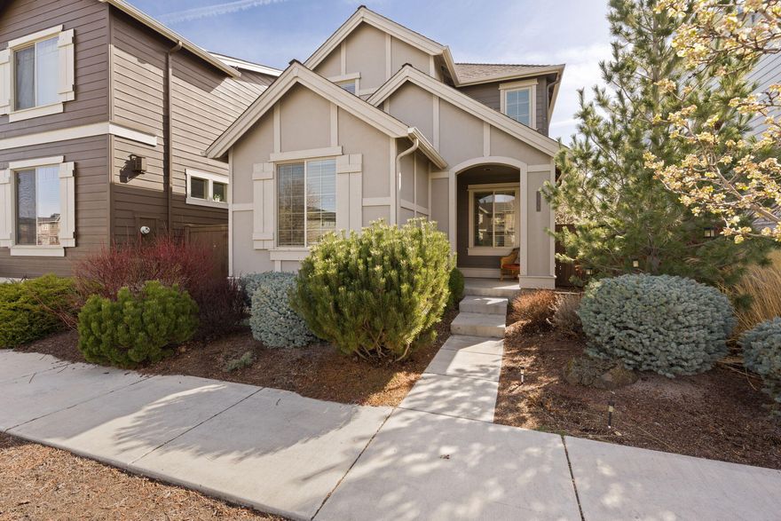 Don't miss this charming craftsman style home located in the desirable Parkland Community in SW Redmond! Open floorplan ftrs warm wood look flooring throughout main living areas, an abundance of natural lighting, & a cozy gas burning stone surround fireplace w/built-in recessed mantle area. Kitchen ftrs quartz counters, warm alder cabinetry, breakfast bar seating, stainless steel appliances, & large dining area w/sliding doors leading to patio. Spacious primary suite w/recessed ceilings, walk-in closet & primary bath w/dual sinks + step-in shower. Two addtnl well appointed bedrooms share a full bath w/shower+tub combo. Full laundry room, den or 4th bedroom, a versatile loft space separating bedrooms, A/C, double garage w/coated floors, ally access, side patio w/decorative stones + NEW exterior paint. Located near elementary school & less than a ten-minute drive to the airport & the fairgrounds. Low monthly HOA w/park & home backs to a green common area w/canal & walking path!