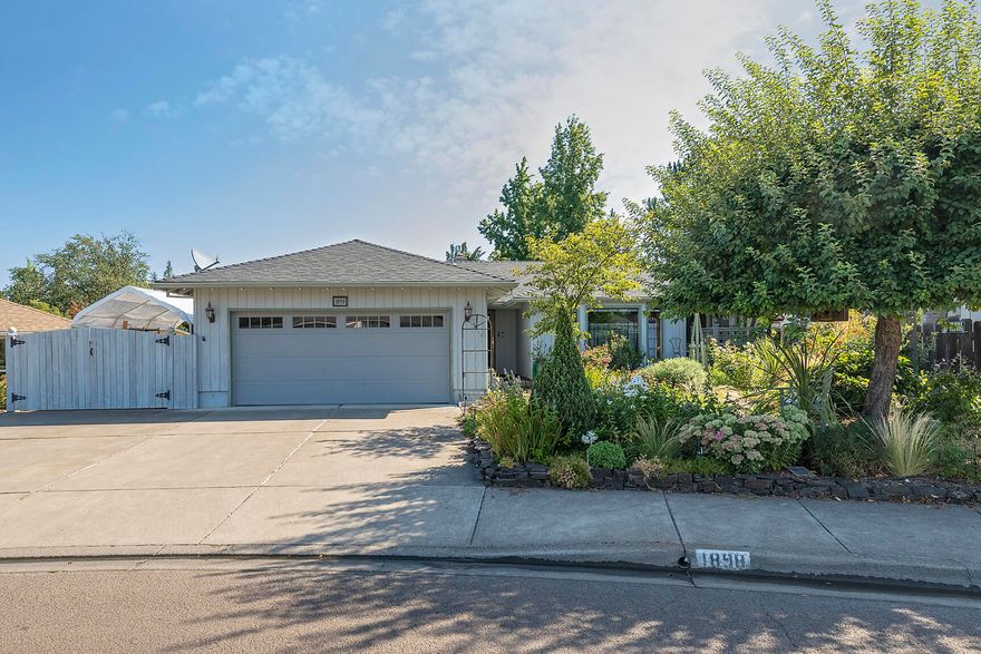 Well-appointed home in an established neighborhood and fantastic location. Built in 1989 by De Carlow 3 bed 2 bath 1759 sf.
Brand new roof just installed 8/2022. Formal and casual spaces, large kitchen with tons of cabinets, all appliances included, corner brick fireplace for the cozy factor.
The landscaping is truly a labor of love with master gardener touches throughout and has been on many garden tours in the past.
Front and back sprinklers , drip and fully fenced. There is a covered back patio, side vegetable garden and gated covered boat or RV parking. Inside laundry room and 2 car attached garage with additional storage.