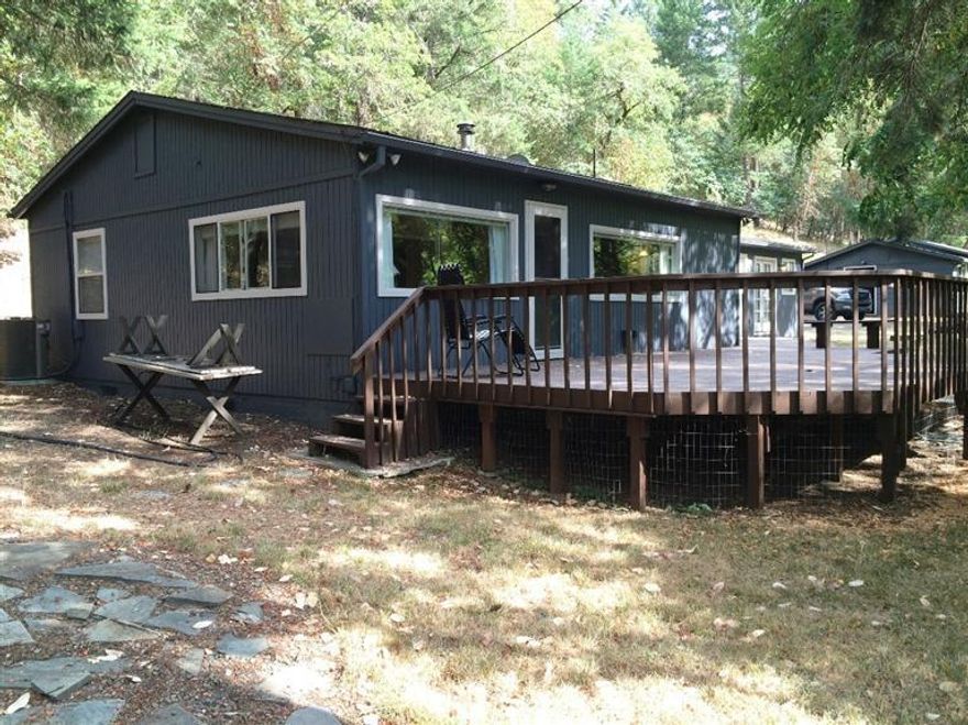 Just minutes to downtown Medford and Jacksonville, this 3 bedroom, 2 bath home is situated on just over 1 acre and is a turnkey property for someone wanting the out of town feeling. In addition to the home the property has a 1050 sq ft shop/studio and the historic touch is an additional 750 sq ft guest cottage that was an old gold mining office. Multi-family set up, additional income or additional storage, this property has it all! Ready and priced to sell, this beautiful Knowles Road property is waiting for you to call it home.