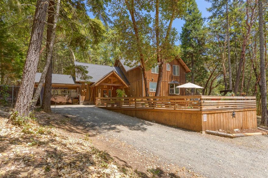 Multi-Family.Beautiful park-like setting w/two homes on 5.5 acres. Cedar sided home is 3bd/2ba, 2328sf w/soaring wood ceilings, ceiling fans, loft and a wall of windows to take in the mountain views. Cooks kitchen w/newer appliances, snack bar, gas cooktop, pantry, tile counters & backsplash. Great room w/Blaze King wood stove, wood floors, dual sliding glass doors to the deck. French door off the master bedroom and master bath suite features dual sinks, soaking claw foot tub and walk in tile shower. The master bath and kitchen tile floors have radiant heat.Theater/family room wired for surround sound with Vermont Castings wood stove. Large deck perfect for entertaining. Upstairs Kids fort/playroom. Garden and firewood sheds. Manufactured home features 3bd/2 full baths, 1188 sf., covered deck, front/back porches w/handicapped access ramp. Detached garage/shop is 24x36 and includes a guest area. RV garage, hot tub and above ground pool. Established garden area. Motivated Sellers.