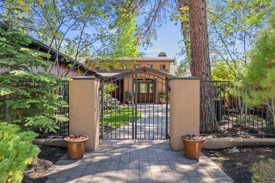 This incredible Norman Building & Design property offers unparalleled craftsmanship and exceptional finishes in an idyllic South facing location on the 15th fairway of the Broken Top Golf Course. The amazing courtyard and fountain greet you at the entrance. Meticulous wood work throughout this single level home shines at every corner. The foyer opens up to a beautiful entertaining space with stone fireplace and formal dining area, all under gorgeous tongue and groove vaulted ceilings. The radiant heated floors run throughout the entire living space. The vaults and beams continue in the spacious primary suite, ample walk in closet with built-ins, and luxurious bathroom. Large office with beautiful built-ins make for the perfect work from home space. Enjoy the covered back patio with surrounding landscape, perfect for outdoor living. The 4 car garage offers plenty of room for all the Bend gear! Don't miss this impeccably kept home in the desirable gated community of Broken Top.