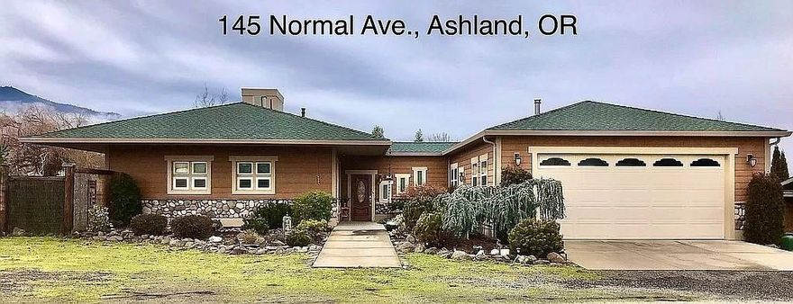 Single level, fenced, irrigated one-acre home has 3 bedrooms/2.5 baths plus large den on cul-de-sac w/360-degree mountain/valley views. Features high ceilings/fans, skylights, French doors, walls of windows, Solar Electric, radiant heat floors, & wood stove. The Great Room has granite island w/wet bar, pantry, & 20' vaulted ceiling. Tiled floors throughout, carpeted bedrooms. Master has armoires, built-in shelves, double closet, private bath w/jacuzzi tub/shower. Wraparound deck w/retractable awnings, screen-in gazebo w/ceiling fan. Landscaped acre boasts pond w/waterfall, gas firepit, covered patio dining, 8 garden beds & 5 fruit trees. Attached insulated 2-car garage w/workbench, shelving & closet. Detached storage shed includes riding lawn mower. Lots of off- street & RV/boat parking. Located 5 min. from downtown Ashland Plaza, grocery stores, bike/hiking trails. Nearby attractions of skiing, rafting, fishing/boating, art/science museums, & SOUniv.