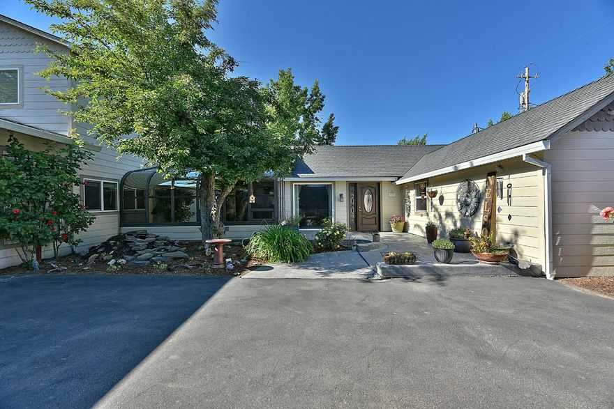 Lovely home on the market in a desirable Central Point neighborhood! Lots of room 1750sq ft with 3 bedrooms, 2 bathrooms and a split floor plan. Many updates completed in 2016 featuring new siding, windows, electrical, and plumbing, as well as a fully remodeled kitchen complete with granite counters, new cabinetry, gas stove top, double oven, pantry and more. Multiple living spaces with hard flooring including living and family rooms as well as a welcoming sun room to enjoy on a cold or warm and sunny day! Well maintained backyard is an entertainer's delight featuring nice grassy areas, covered patio with ceiling fan, above ground pool and decking. Also included is a large 750sq ft garage, RV parking and hookups. Don't hesitate on this one--- it will go fast!