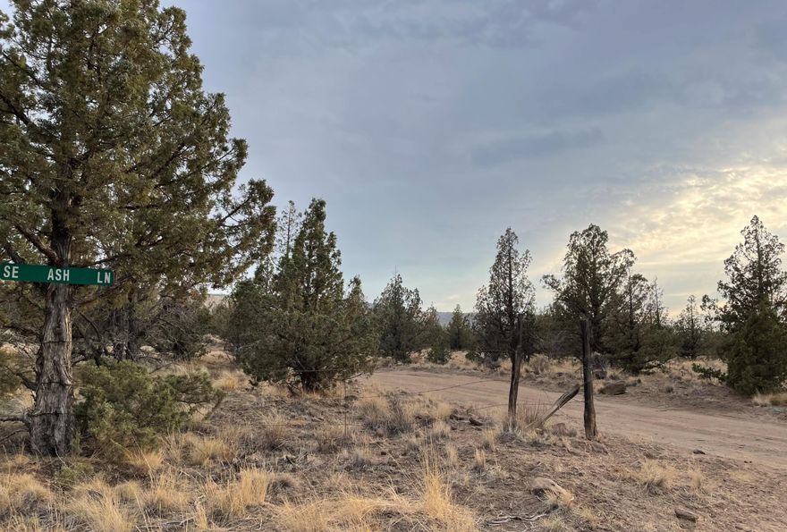 Privacy and Cascade Mountain Views from this slightly sloped 10 acre lot that's deep into Juniper Acres. This is a corner lot off of Ash & Bend, it's off grid and non-buildable. The lot is the prefect spot to set up ''base camp'' for all sorts of recreation with reservoir Road OHV Play Area, Four Corners OHV Staging Areas, Millican Valley OHV Trail System, and Alfalfa Curves OHV Staging Area all close by! Prineville Reservoir is just a short drive away. After a hard day of playing, check out the amazing sunsets and watch the stars in this area known for stargazing.