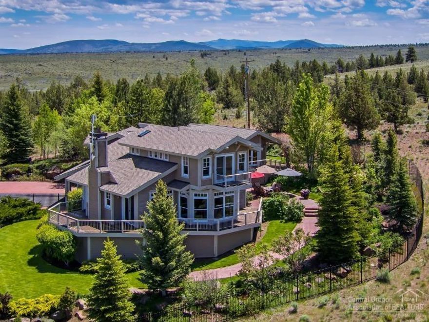 Spectacular custom home w/360 degree views of the Cascade Mtn range, Smith Rocks, Powell Butte, Ochocos & Paulinas. If you are looking for privacy this is the home! Floor-to-ceiling windows bring the outside in! Hardwood floors throughout the main living area. LR features gas FP w/slate surround & blt-ins on either side. Fabulous DR w/ views to die for! Kitchen features tiled counters, island, blt-in desk & breakfast nook. Master w/updated bath. Fabulous office! The grounds are a master gardener's delight!