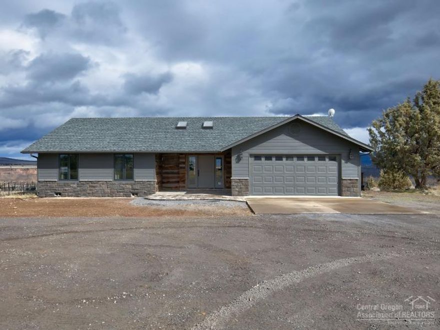 This amazing home on 2.6 acres on the Crooked River Rim brings the outside in overlooking the golf course and Crooked River Ranch. Ranch Style home remodeled in 2016 includes: 1879 sf, oak floors, new high end appliances, leathered granite slab counter top, stone fire place between kitchen and living room, 2 new master suites, utility room, deck, and attached garage. 3 bay shop with 3/4 bath and office area. Fantastic Location for a unique home and property with Smith Rock views.