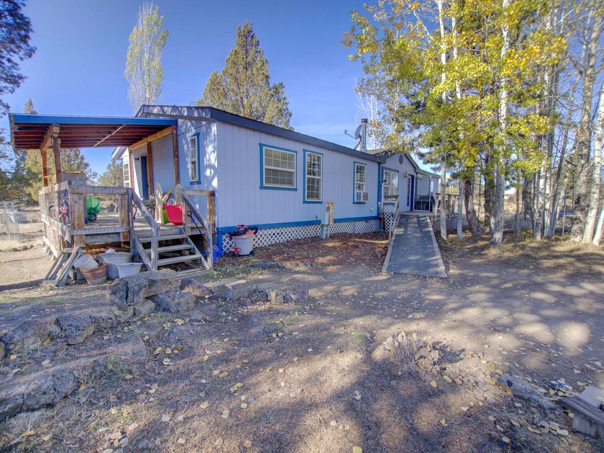 Peace and tranquility await you on this private 5 acre property tucked away in the Crooked River Ranch community. Property backs to public land with miles of trails for walking, biking, ATV or horse riding. Ranch amenities include golf, tennis, hiking and fishing. Residents enjoy the abundant wildlife and natural beauty of the area. 

Open concept manufactured home with new laminate flooring and new kitchen in 2021. Vaulted ceilings and large windows allow for an abundance of natural light. Dining area and additional eating area in kitchen. Primary suite is separated from guest bedrooms and has a soaking tub. Bonus room can be used as an office or 4th bedroom.

Ample outside storage includes: a wood shed, garden shed, storage shed, lean-to, and a 24x24 concrete slab for RV parking or possibly build your own garage.

Call your realtor for a showing today!