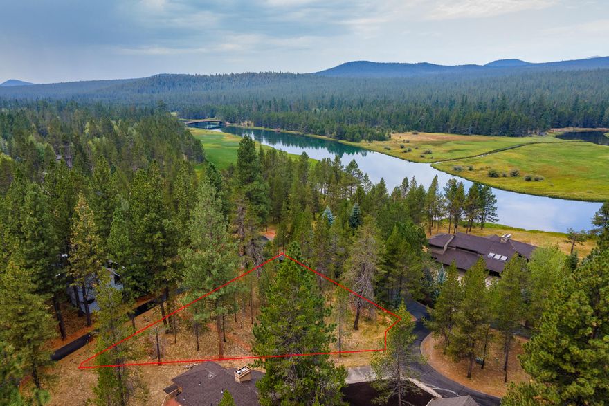 Build your dream home or vacation investment opportunity on this flat, 0.3 acre parcel, surrounded by mature trees and steps away from the Deschutes River. SHARC paid in full! This site would be ideal for a sizable luxury home with multiple master suites. The quiet north-end lot allows for a short walk to the award winning Woodlands Golf Course, the North Pool (owners-only), and the Cardinal Landing footbridge over the river and into National Forest.