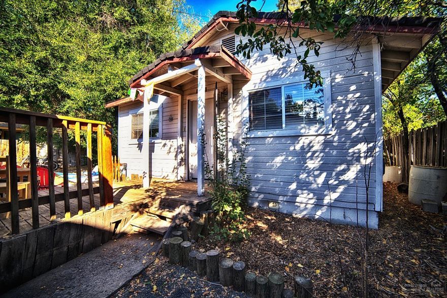 Westside charmer in great location and in walking distance to downtown, Drake Park and Deschutes River.Situated on a .08 acre RM lot, this home boasts 2 or 3 bedrooms, 2 full baths, and oversized single car garage with alley access. Great investment opportunity. Buyer to do due diligence regarding development.