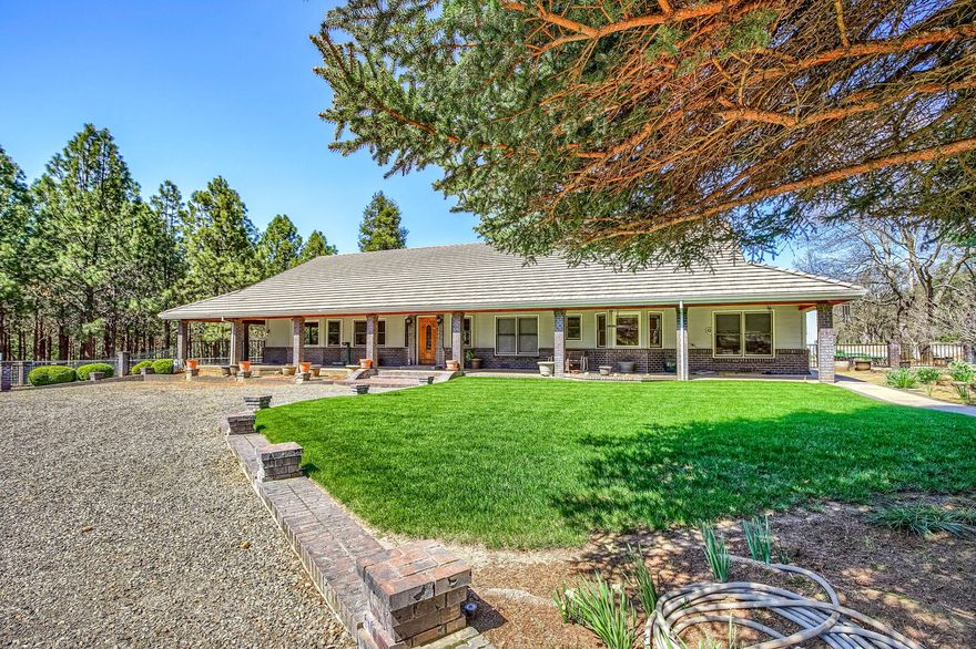 Northwestern Elegant custom built! Over 3800 sq. ft. 4 bed home with level 25.7 acres with Irrigation rights and huge detached 8 bay garage and outbuildings! Located within walking distance of the mighty Rogue River, This private paradise is minutes to Medford and offers fast internet, natural gas, cross fencing, cement walk ways, wrap around covered porches, immense great room with floor to ceiling stone gas fireplace, and soaring wood beamed ceilings! Kitchen has Jenn Aire cook top, wall oven, terrazzo tile island, windows galore, plant room, and more! This home has wonderful split floor plan with mother  in law suite, ample storage and built ins, and quality throughout. Attached garage is oversized 2 car and detached 8 bay garage is approx. 5000 sq. ft. with several doors and two offices. Lovely close-in property perfect for work from home folks, farm, fishing, white water rafting, horse farm, or just get away from it all. 35 gallon a minute well, manicured lawn, pasture and woods.