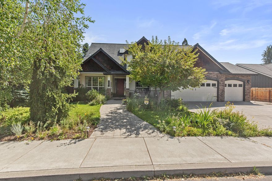 Welcome home to Tanglewood in SE Bend. Grand entryway and an office complete with a fireplace and bookshelves. Nearby formal dining room can also be used as an office or craft room. The large gourmet kitchen includes many features like granite counters, abundant storage and a walk-in pantry. The Primary bedroom on the main level has a walk-in closet and full bath with a jetted tub. Upstairs are three more bedrooms, two with walk-in closets, an open ceiling living room and adjacent bonus room currently used as a theater/music room. The large backyard is perfect for entertaining with an 8 person hot tub and a pond with a waterfall.  Grow veggies in raised garden beds made from reclaimed wood. The 3 car garage is fitted with a 250 V plug for an electric car or shop tools and provides ample storage space in attic. There's a bonus shop area on the side of the house with built-in workbenches, generous lighting, and space for tools and adventuring toys for enjoying all that Bend has to offer.