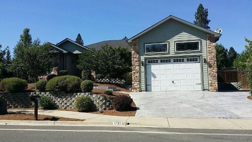 Welcome to Forest Hills in NW Grants Pass. This exclusive neighborhood is made up of one of a kind custom homes and this one will open your eyes to custom craftsmanship. As you pull onto your stamped concrete driveway there is lots of parking and space for an RV or toys. As you enter the home the high ceilings await you with a grand open family room off the kitchen with granite and steel appliances in the kitchen. Solid wood beams greet you overhead in the spacious dining room. Rope lighting is found throughout the home. The master bedroom has a custom one of kind ceiling with dimmers that set the mood. Gracious bathroom with nice large walk in closet. Ready for more? Step outside to the backyard to your park like setting and raised garden bed area complimentary with patio and amenities. Class and special touches will surprise you. Put this gem on your list to view in Forest Hills, just minutes from Downtown Grants Pass.