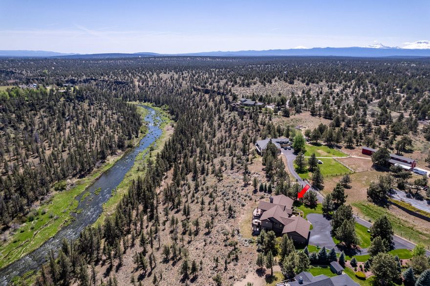 Welcome to one of Eagle Crest's most exclusive properties, where luxury meets resort living. This immaculate 1.38-acre estate offers rare Deschutes River views and sits behind a security gate with a private pool and pickleball court. Enjoy access to three recreation centers, three pools, and three 18-hole golf courses. Perfect for your next home, second home, or vacation retreat, this home blends sophistication with outdoor adventure—fishing, hiking, and kayaking right from your doorstep. From custom woodwork and elegant 8-foot doors to the gourmet kitchen with granite countertops, no detail is overlooked. Primary suite on the main level and additional guest suite upstairs. separation on the lower level features an additional guest suite, a guest room, a family room featuring a wet bar, and bonus room with wine rack. The garage offers additional storage space, epoxy floors, and ample room for vehicles and gear. Enjoy the breathtaking canyon views from the two level deck or Hot-tub!