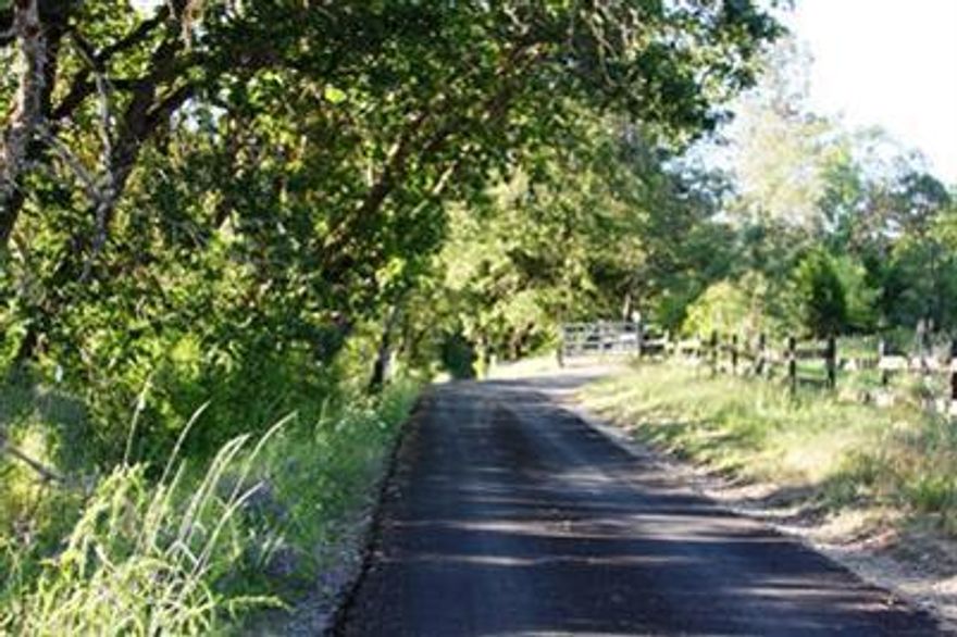 Incredible 5 acre parcel ready to build your dream home! Boasts rolling oak studded meadows, large pond with dock, private setting, and paved road with gated entrance. Well in and septic approved. Bring your plans or let owner build to suit. Secluded off road setting along the historic Old Stage corridor, minutes to Jacksonville, but centrally located offering easy freeway access.