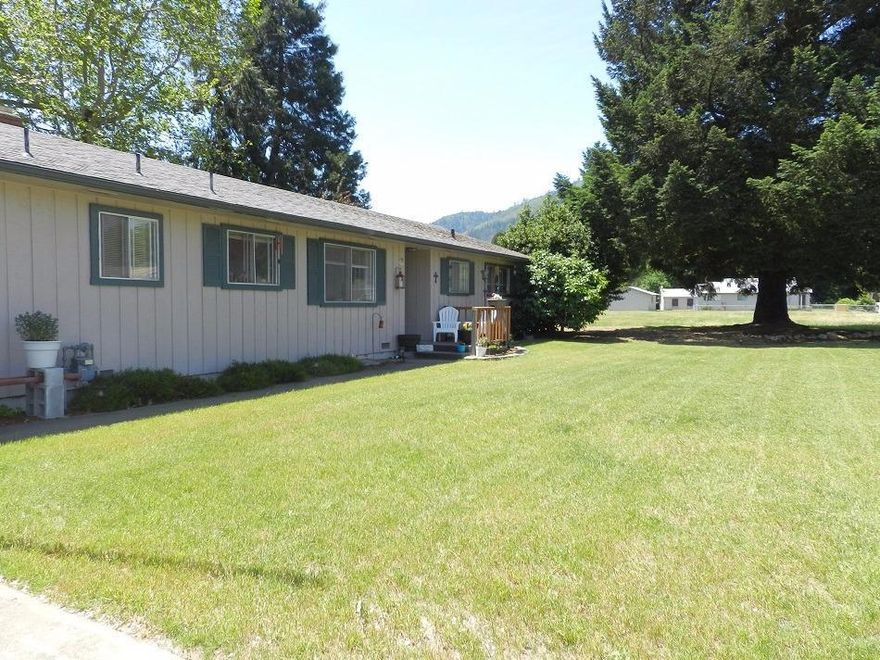 (Strictly by Appt. Only) Quaint rural town of Rogue River is just what you have been looking for, then look no further! This awesome well cared for ranch style home is on a large .33 acre lot and just under 1600 square feet. You will find that this home really brings the outside in with a huge oversized sliding door off of the living room, and a standard sized sliding door off of the den. Both look out to the covered patio and the mountains in the distance. The fireplace is a real eye catcher, with 2 sides to enjoy. There are 3 bedrooms, 2 baths, a nice sized laundry room and an attached garage fronts a nice sized wrap around driveway, and there is enough room on the side yard for RV parking. Tenant currently have a good sized round pool there. The other side of the home has room for a nice garden or ?? The home is on city water, but there is a well that has previously been used for outside watering. The seller had insulation blown into the walls since they have owned it.