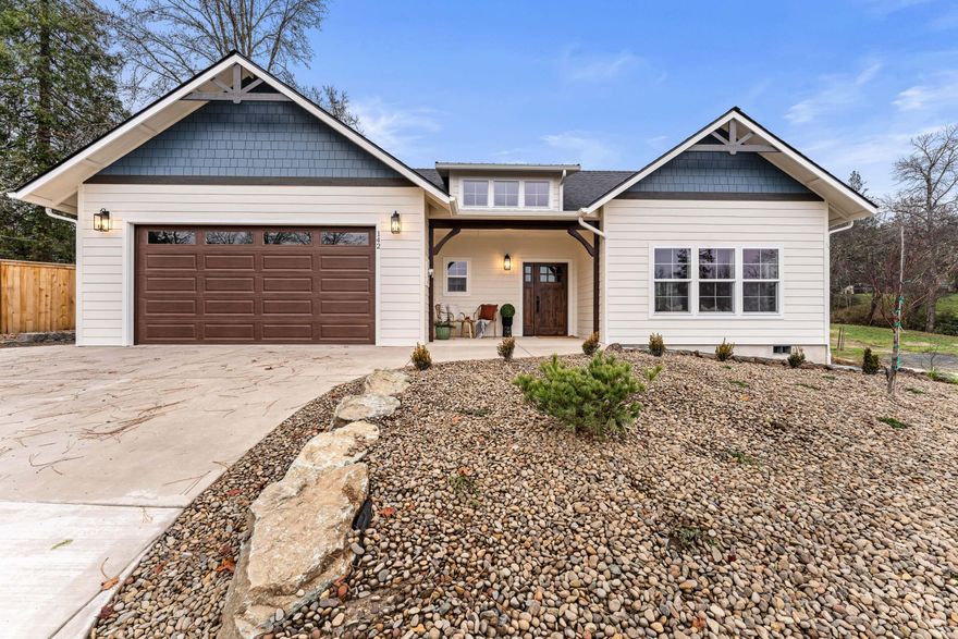 Welcome to 142 NW Crest Dr - a rare opportunity to own one of the few brand-new homes in this sought-after area. This 3 bedroom, 2.5 bath home offers a bright, open floorplan designed for both comfort and style. The heart of the home is the chef's kitchen, featuring custom cabinets, granite countertops, a large island, stainless steel appliances, and a beautiful tile backsplash. The living room is filled with natural light and anchored by a cozy gas fireplace. The spacious primary suite includes a walk-in closet, spa-like bathroom with double vanities, tile shower, and a soaking tub. Step outside to enjoy the covered patio, perfect for year-round outdoor living. Don't miss this opportunity to own a thoughtfully designed home in a prime NW Grants Pass location! Estimated completion is December 2025.