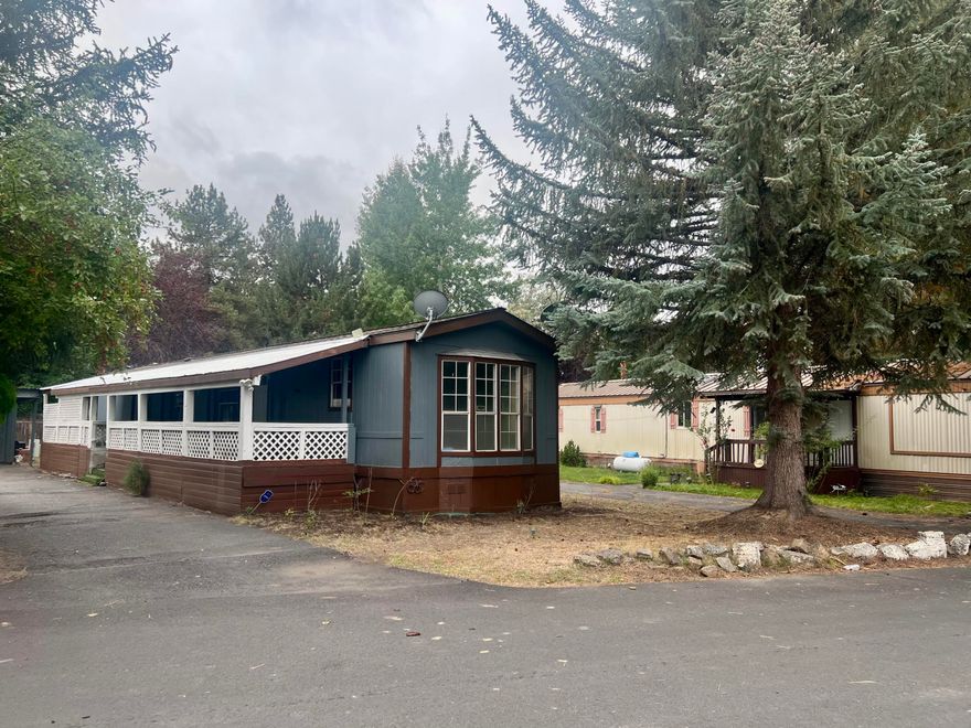 Affordable mobile home located in a family-friendly park on the east side of Bend! This home is tucked away toward the back of the park, offering extra privacy and space. It features a large driveway with plenty of room for vehicles and a spacious lot area.

The home needs some TLC, giving you the perfect opportunity to add your personal touch and make it your own. With a bit of vision and care, this property can shine again. Conveniently located near schools, new Bend library, shopping, and parks — a great chance to own an affordable home in Bend!