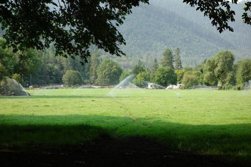 Beautiful, hard to find Applegate River front property with over 900 ft. of river frontage. 32.8 acres of level irrigated land with older water rights. The East and West sides of the property have underground main lines with valves for easy irrigation. Includes pump and fuel tank. Property has homesite approval. Zoned EFU, could be a great property to graze cattle,grow hops, blueberries? Listing agent is related to seller. Buyer to perform due diligence regarding property uses, property lines, easements and water rights.