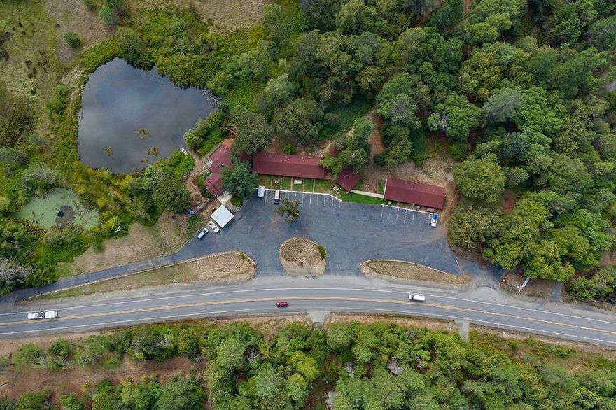 Illinois Valley Landmark! The Holiday Motel has been locally owned and operated since 1976. Well established 11 unit motel with office and living quarters attached. Excellent, high exposure location! 3.34 acres on Redwood Hwy. Zoned rural commercial with endless possibilities! Property is sold as a operational motel, including inventory and furniture. Motel rooms have been updated with new paint, carpet and are fully furnished. The back 25.53 acres are zoned EFU, has a 50x100ft barn with a spring fed pond and access to the beautiful Illinois River. -Owner is a licensed Real Estate Broker in the State of Oregon.