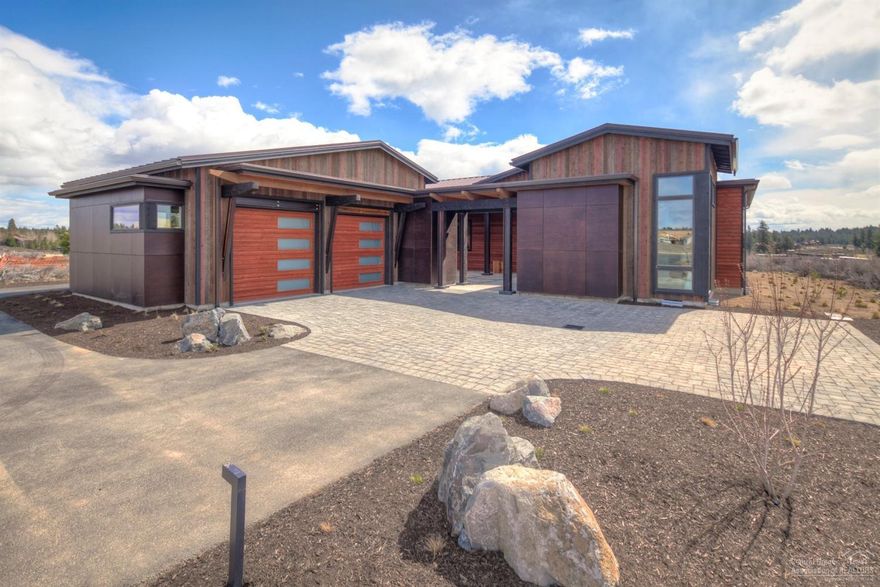 Perched on the ridge facing Tetherow Golf Course, this spacious modern single level home features 3 bedrooms, 3.5 baths, study, & 3 car garage. Move in ready and loaded with goodies including steel accent beams, imported siding from Spain, epoxy garage floors and extensive garage cabinetry, deluxe master closet package, all appliances including refrigerator & washer/dryer, office built ins and more! This is an incredible opportunity in Bend's premier neighborhood, Tetherow!