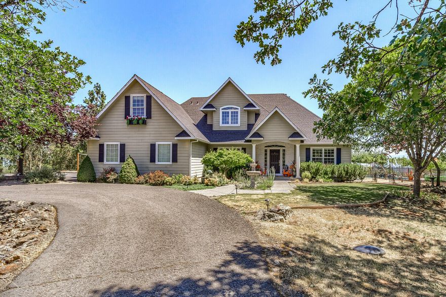 With breathtaking views of city lights, the Rogue Valley & Mt. Mcloughlin, this private estate offers a retreat like living! Located minutes from all that Historic Downtown Jacksonville has to offer, restaurants, shopping & miles of hiking trails; this 4 bdrm/3 ba home has been thoughtfully & creatively updated with a spa like primary en suite, exiting to the in-ground pool/patio area & private outdoor shower. Soaring ceilings, HWD floors, formal & informal living areas, the home boasts a spacious kitchen that offers an eating bar, 4 gas burner stove,  walk-in pantry. Off the kitchen there is a gas fireplace & wood burning insert in the main living room. The upstairs has 2 bdrms, a ba, a bonus room & small office area. While enjoying the view, take advantage of the covered patio, sand volleyball court & large finished & heated shop for all your hobbies. There is RV/boat/toys parking. Deer resistant garden area. This 60 + acres connects to the Britt trails for a nice stroll into town.