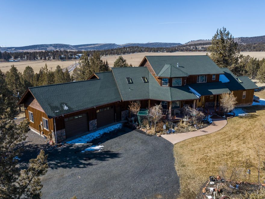 A rare opportunity, if you farm or raise livestock. This beautiful custom 2 story home has 4 bedrooms, 2.5 baths 2 island Kitchen, walk-in pantry, and custom wood work are just a few up the must sees in this beautiful home. The home sits over looking the 160 acres with 118 acres of Ochoco water. That is irrigated with a pivot and wheel lines, Pivot currently planted in Orchard grass. Approximately 40 acres is fenced and cross fenced. 9000 sq ft shop that has several sought after features. A 5184 sq ft Hay barn that has a concert floor. Along with several other out building. The 728 sq ft single wide manufacture home has two bedrooms and one bath.
( Manufactured home is an 1989 single wide and is sold as is with no stated value). Turkey's, deer, and elk also migrate though property.  LOP tag also are available .