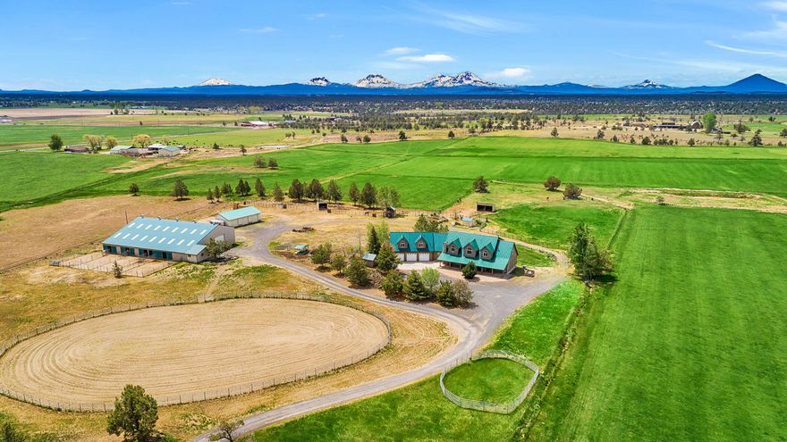 The finest quality and expert craftsmanship come together to create one of Central Oregon's finest ranch properties. Find your personal haven tucked at the base of the Cascades. Thoughtfully designed custom home is positioned on the property to maximize seclusion and commanding views of the mountains and Smith Rock. No details overlooked, enjoy main level living with open floor plan, media room, wet bar, tall ceilings, and attached 3 car garage and dramatic log accents throughout. Plenty of space to work from home, entertain, and lock off apartment has its own kitchenette, balcony, and living room. Outside find comfortable dog kennels, custom chicken coop, 3 bay shop/garage and captivating pond views. Horse facilities feature 50x100 indoor arena, outdoor arena, 8 stalls with runs, heated tack room with full bath, and round pen. Property has 60+/- acres of water rights for hay and grazing livestock. Exceptionally cared for and ready for you to experience the elegant ranch lifestyle.