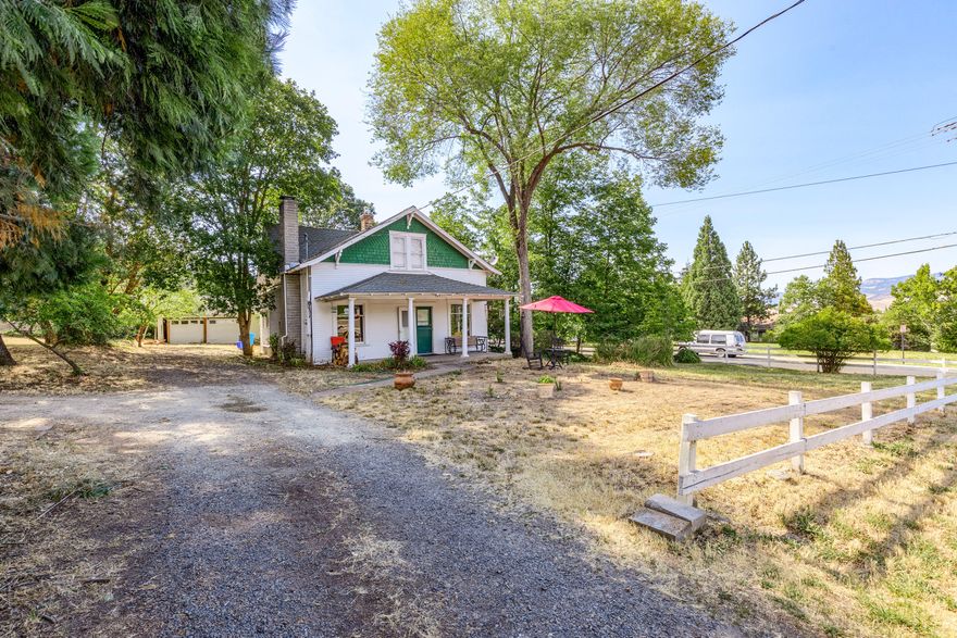 Excellent opportunity to own an early 1900's  home on a large half acre, corner lot, with a great central location in Ashland, Oregon.  This property appears to be perfect for Cottage Housing development purposes (potential Buyers should inquire with the City regarding same).  Home has master bedroom on the main level and two additional bedrooms and a shared bathroom upstairs.  The lot is level, has mature trees and lots of potential.
